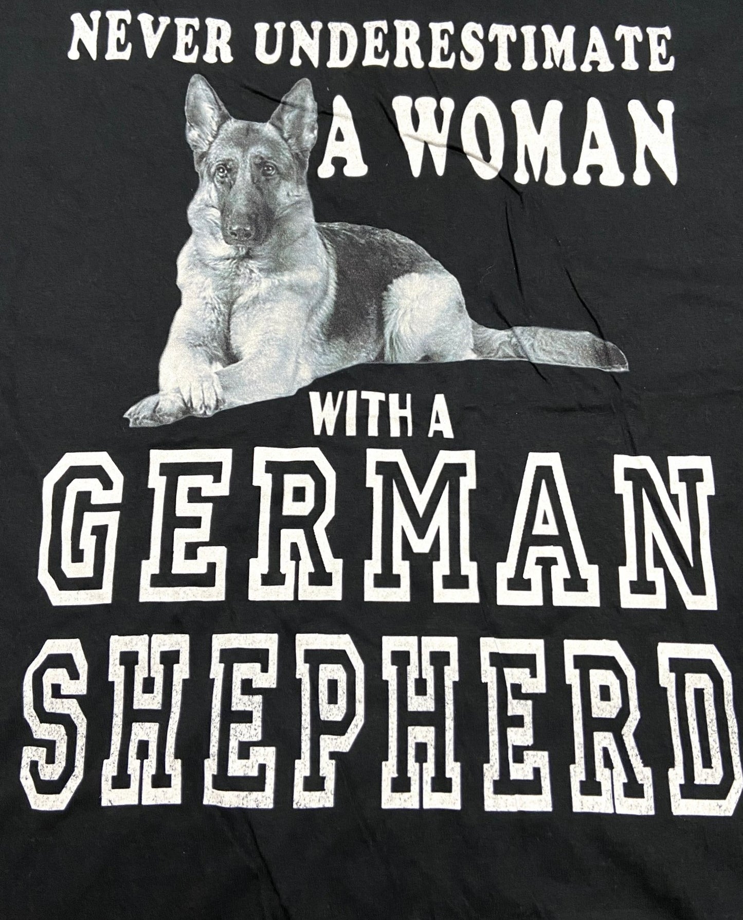 "Never Underestimate a Woman..." Adult XL Black T-Shirt by Unknown